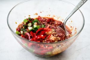 Making a red spicy seasoning paste for perilla kimchi