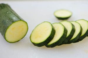 Cutting a zucchini into thin disks