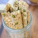 Long sticks of sesame crunch in a small mason jar