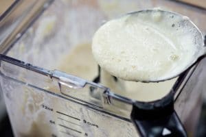 Pureeing soaked soybeans in a blender