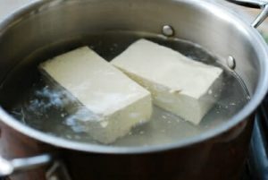 Stir-fried kimchi and pork served with tofu