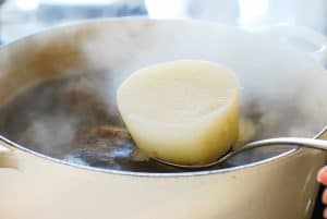 Removing a big chunk of radish from the pot