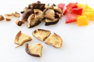 Soak mushrooms and bell peppers being cut
