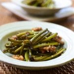 A bowl of stir-fried garlic chives with walnuts